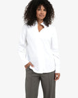 Blouse with high V-neck collar and cuffs