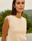 Sleeveless knitted top with playful sleeve edge