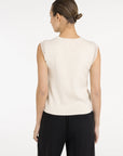Sleeveless knitted top with playful sleeve edge