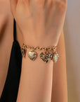Gold Charm Bracelet With Hearts & Flowers