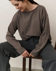 Boat neck sweater with refined decorative seams